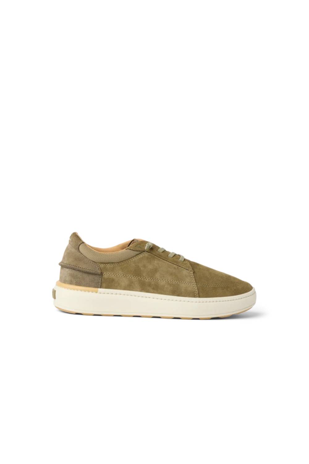 A low-top sneaker in olive green suede and tan leather panels with a thick off-white sole, shown from a side profile on a white background.