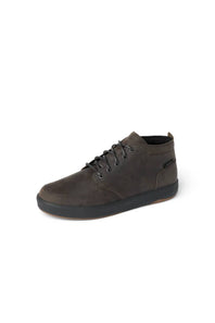 Black lace up sneaker boot on a white background