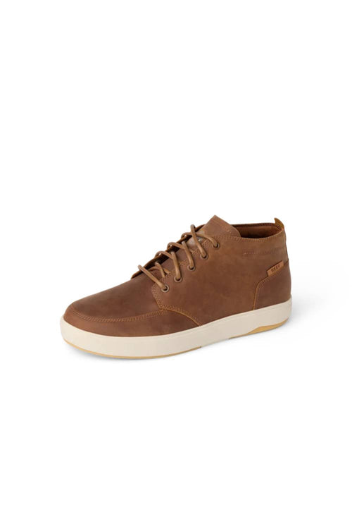 Brown leather Reef boot on a white background