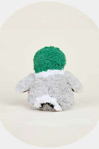 A plush stuffed toy shaped like a duck, shown from the back. It has a bright green fluffy hat, a light gray body, and white accents on the neck and lower back, set against a warm cream-colored background with a circular vignette.
