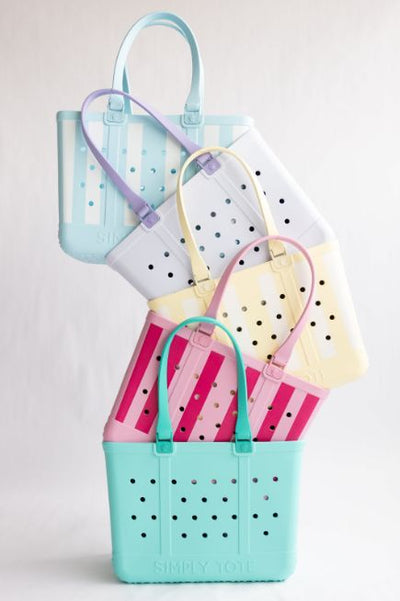 A stack of five Simply Southern totes in front of a plain background