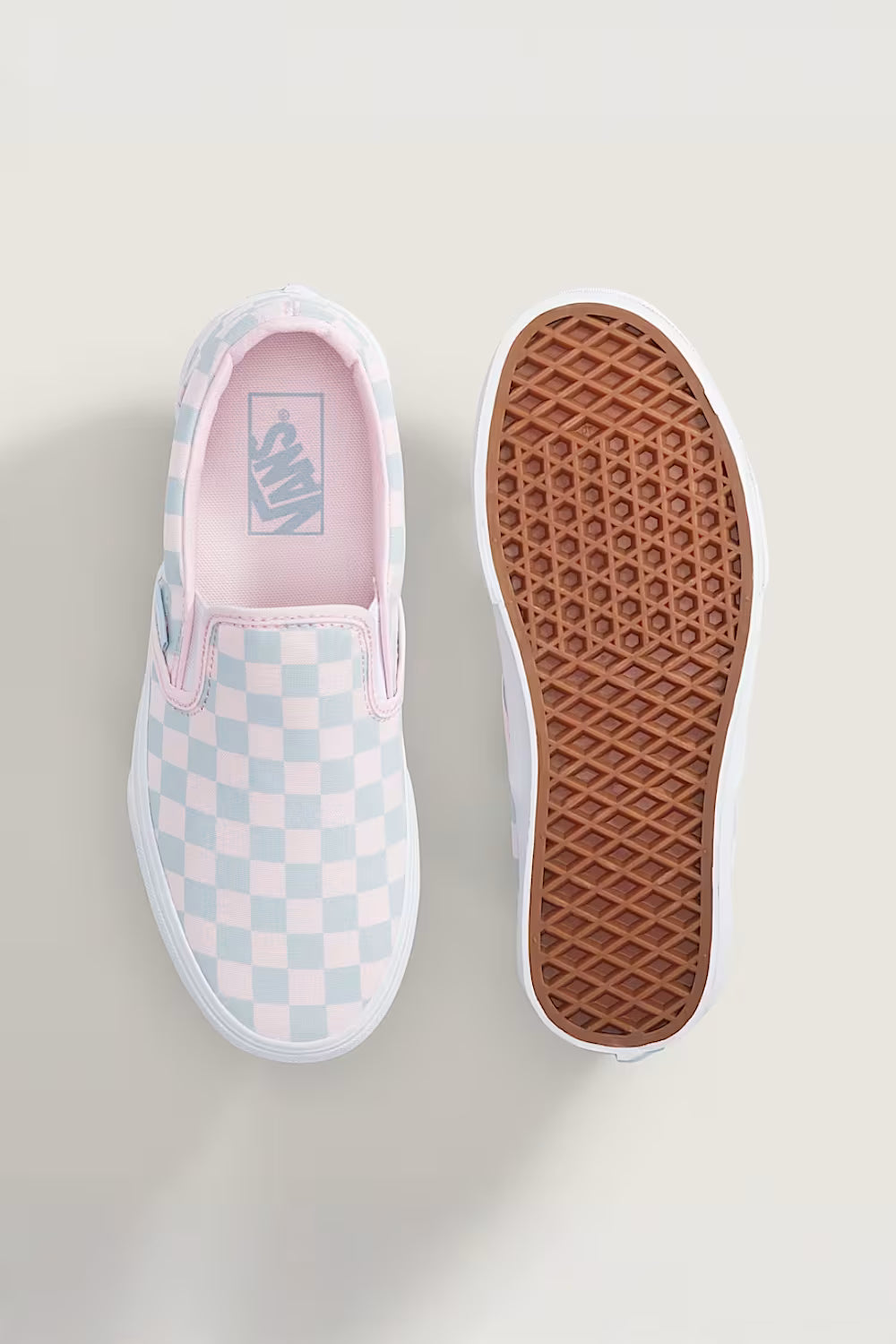 Vans Classic Slip-On Checkboard Shoes for Women in Pastel Pink/Dawn Mist; Vans slip-on sneaker with checkered pattern and brown sole on a light background