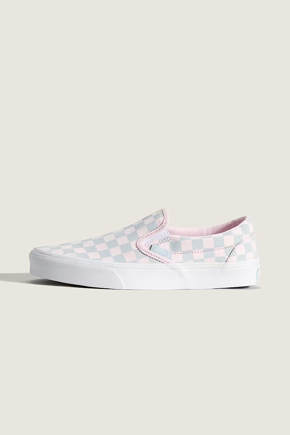 Vans Classic Slip-On Checkboard Shoes for Women in Pastel Pink/Dawn Mist; Checkered slip-on sneaker with pink accents on a white background