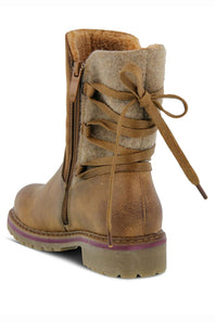 A brown leather lace-up ankle boot with a tan wool-like fleece collar, side zipper, and thick lug sole, shown on a white background.