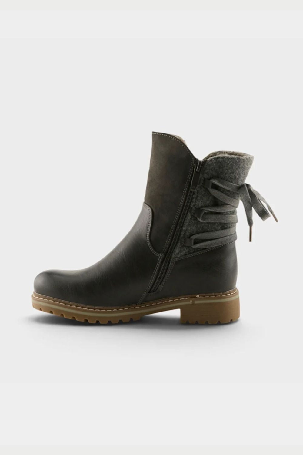 A dark brown leather ankle boot with a side zipper, decorative lace-up detail on the side, and a brown textured sole, shown against a light gray background.