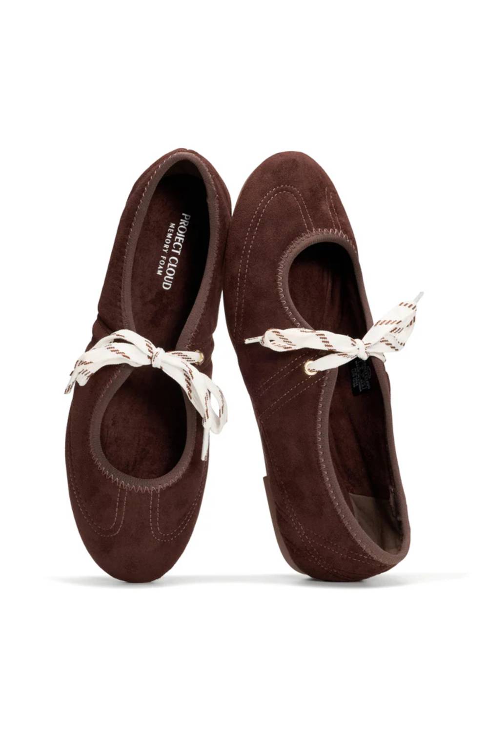 A pair of dark brown suede ballet flats with white rope laces, shown from a top-down view on a white background. The brand name 'PETER JACOBS' is visible on the inner sole of the left shoe.