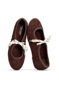 A pair of dark brown suede ballet flats with white rope laces, shown from a top-down view on a white background. The brand name 'PETER JACOBS' is visible on the inner sole of the left shoe.