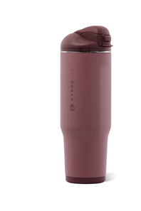 A HydroJug insulated travel tumbler in a dusty rose color, featuring a matching flip-top lid and a vertical brand logo on the front, set against a plain white background.