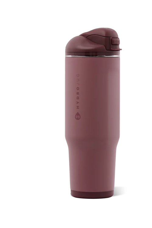 A HydroJug insulated travel tumbler in a dusty rose color, featuring a matching flip-top lid and a vertical brand logo on the front, set against a plain white background.