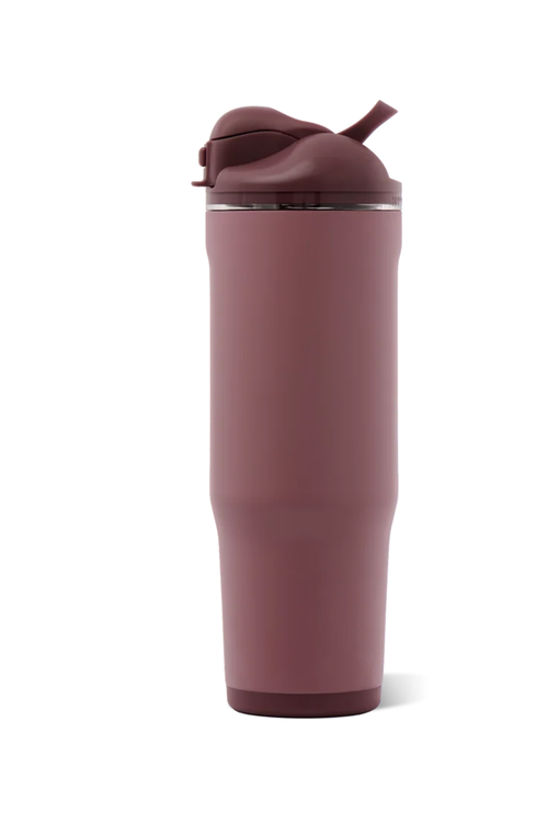 A tall, matte mauve-pink insulated tumbler with a matching flip-top lid and straw, shown on a clean white background.