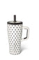 A white ceramic travel tumbler with black polka dots, a black lid, and a black straw, featuring a white handle
