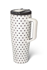 A tall travel mug with a white body covered in black polka dots, featuring a white handle and a black lid with a clear plastic insert, shown on a white background.