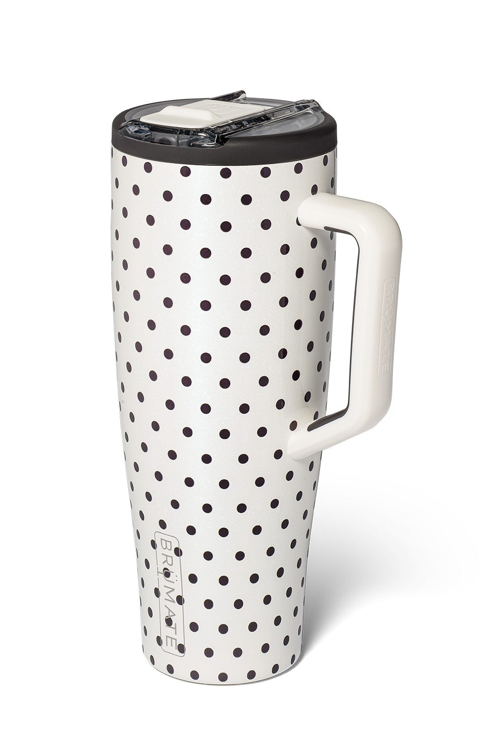 A tall travel mug with a white body covered in black polka dots, featuring a white handle and a black lid with a clear plastic insert, shown on a white background.