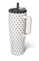 A tall white insulated tumbler with black polka dots, featuring a white handle, a black lid, and a clear straw, shown on a white background.