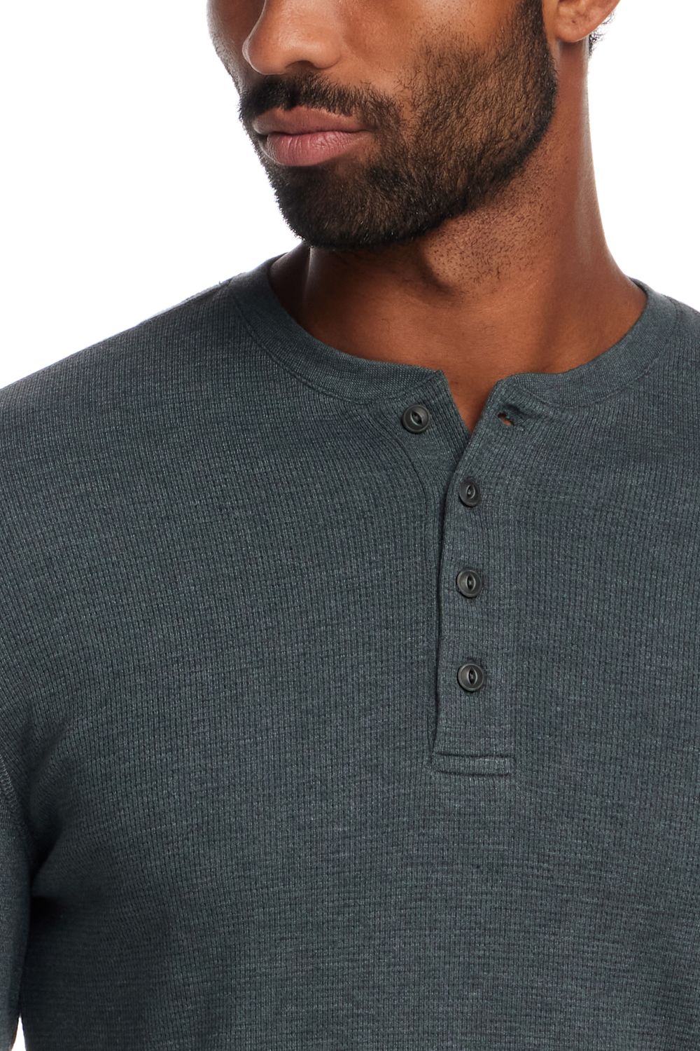 Close-up of a man wearing a dark gray ribbed henley shirt with a three-button placket, shown against a plain white background.