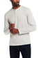 A man wearing a light heather gray long-sleeve henley shirt with three buttons, paired with dark jeans, against a plain white background.