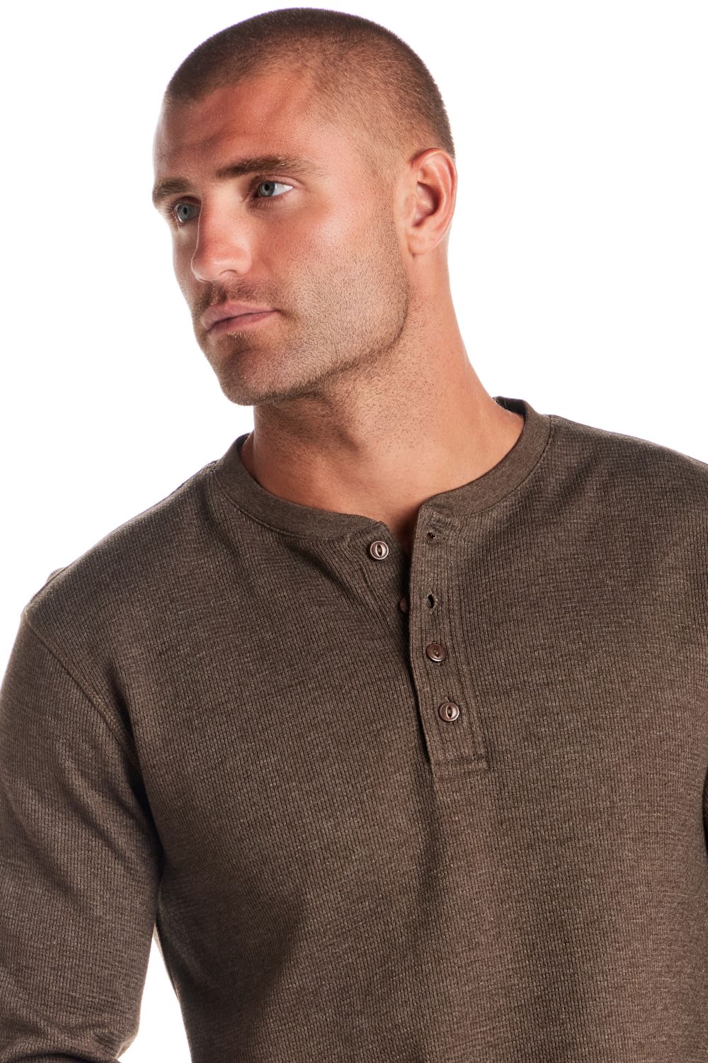 A man wearing a brown ribbed Henley shirt, shown from the chest up against a plain white background.