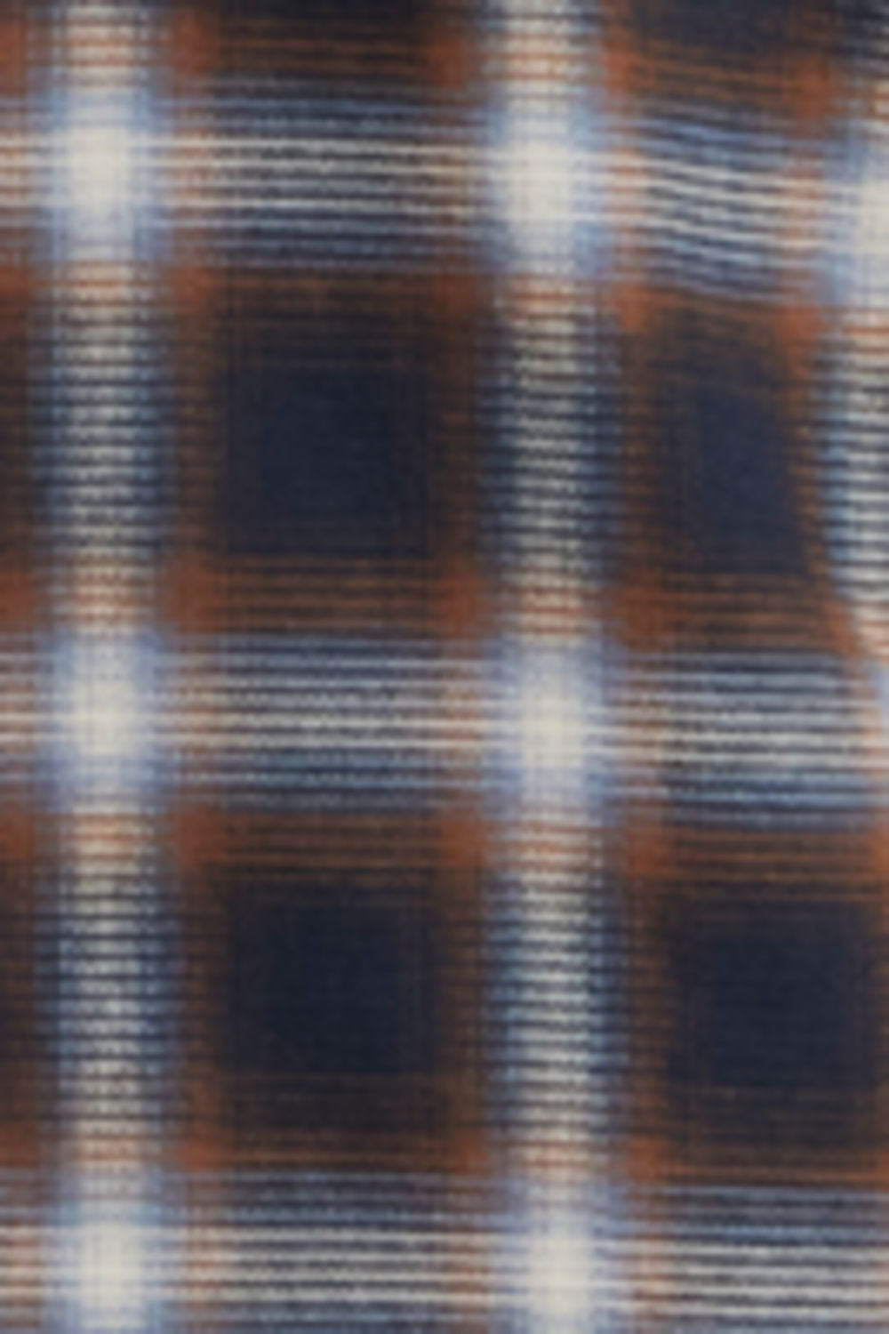 A close-up of a plaid fabric pattern with intersecting vertical and horizontal stripes in dark navy, rust brown, and white, creating a textured woven look.