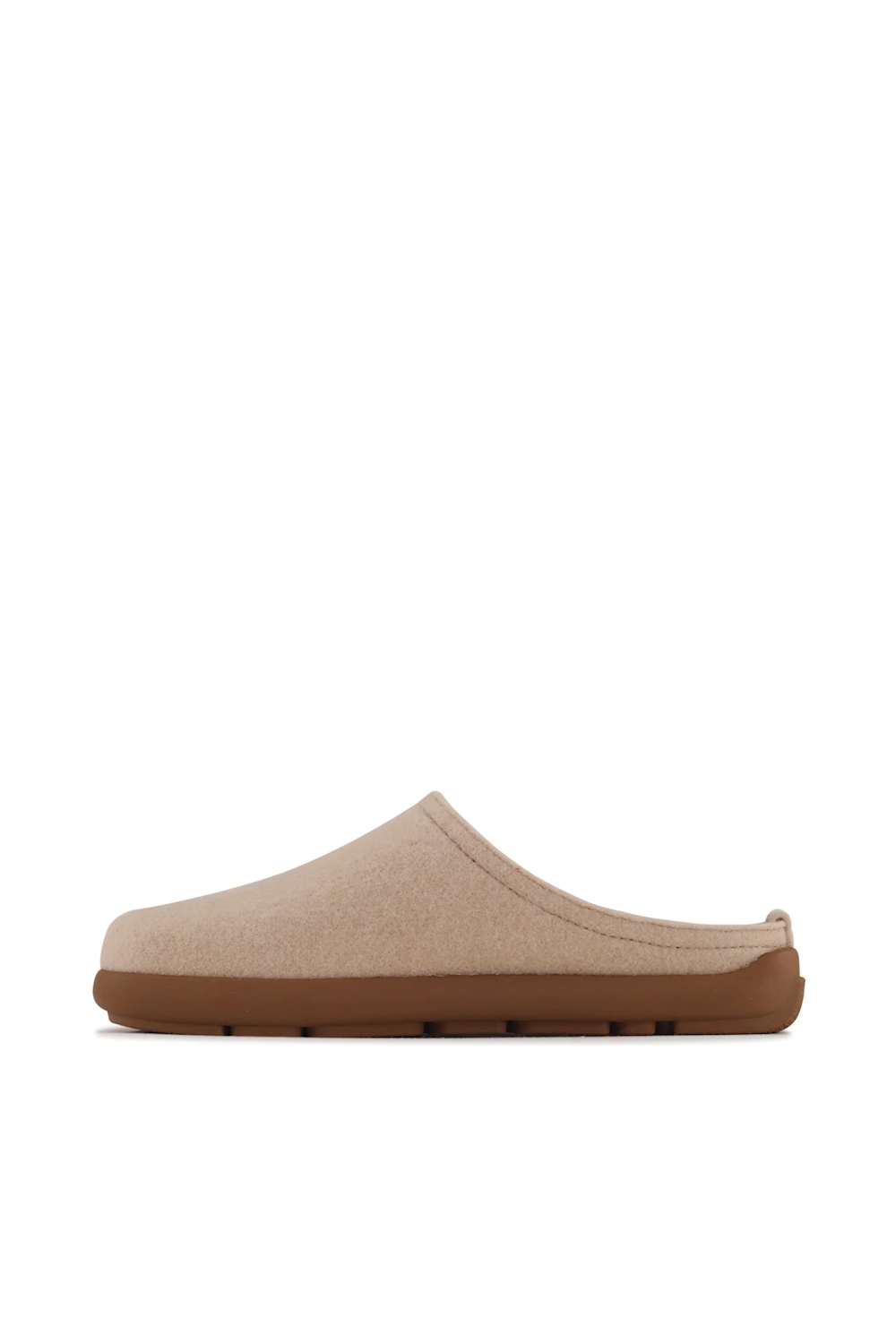A single slip-on clog-style mule shoe in light beige fabric with a brown sole, shown in profile against a plain white background.