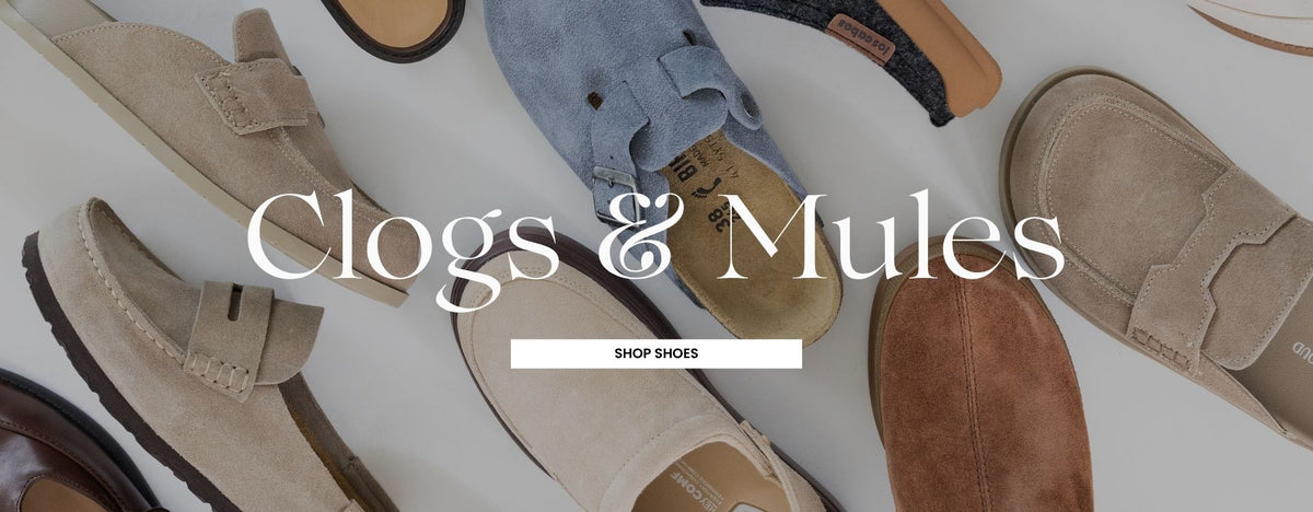 A promotional image featuring different colors of women's clogs and mules on a white surface. There is a dark overlay over the photo with text CLOGS & MULES plus a rectangular call-to-action SHOP SHOES