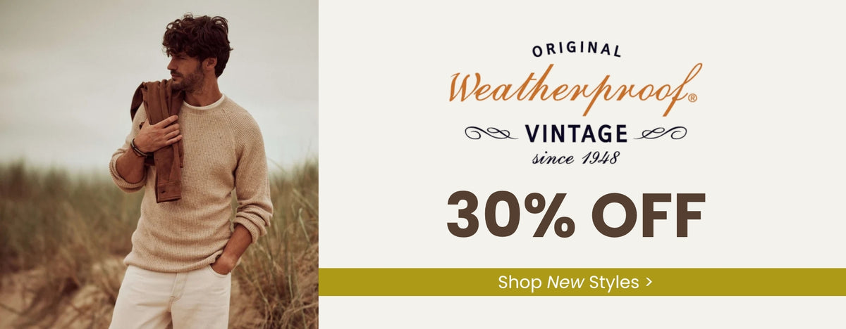 Promotional banner with an image of a man standing outdoors wearing a tan sweater, white pants and has a brown jacket over his shoulder. Text to the right of the image read ORIGINAL Weatherproof VINTAGE since 1948 30% OFF plus a green call to action banner across the right side of the image with Shop New Styles