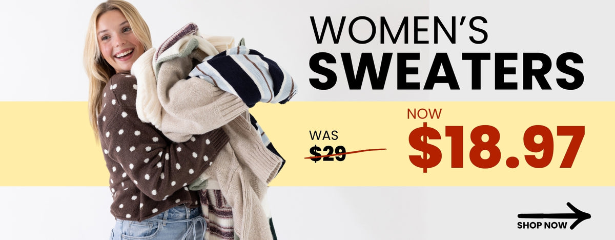 A promotional banner promoting women's sweaters that were originally $29, but are now $18.97. In the image there is also a woman wearing a brown/white polka sweater holding multiple different styles of sweaters and a black arrow in the bottom right corner with a SHOP NOW call-to-action