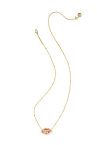 A delicate gold chain necklace featuring an oval pendant with a pink and gold pattern, displayed on a clean white background.