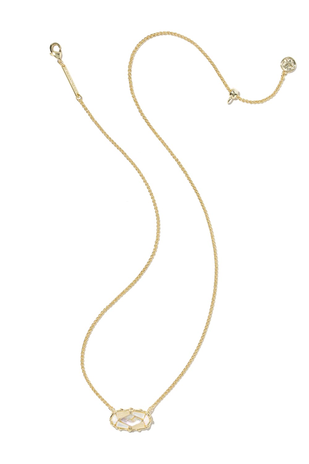 A delicate gold chain necklace with a small oval pendant featuring a clear faceted gemstone, displayed on a solid white background.