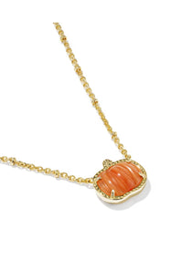 A gold chain necklace featuring a pumpkin-shaped pendant with a carved orange stone in a gold bezel setting, shown on a clean white background.