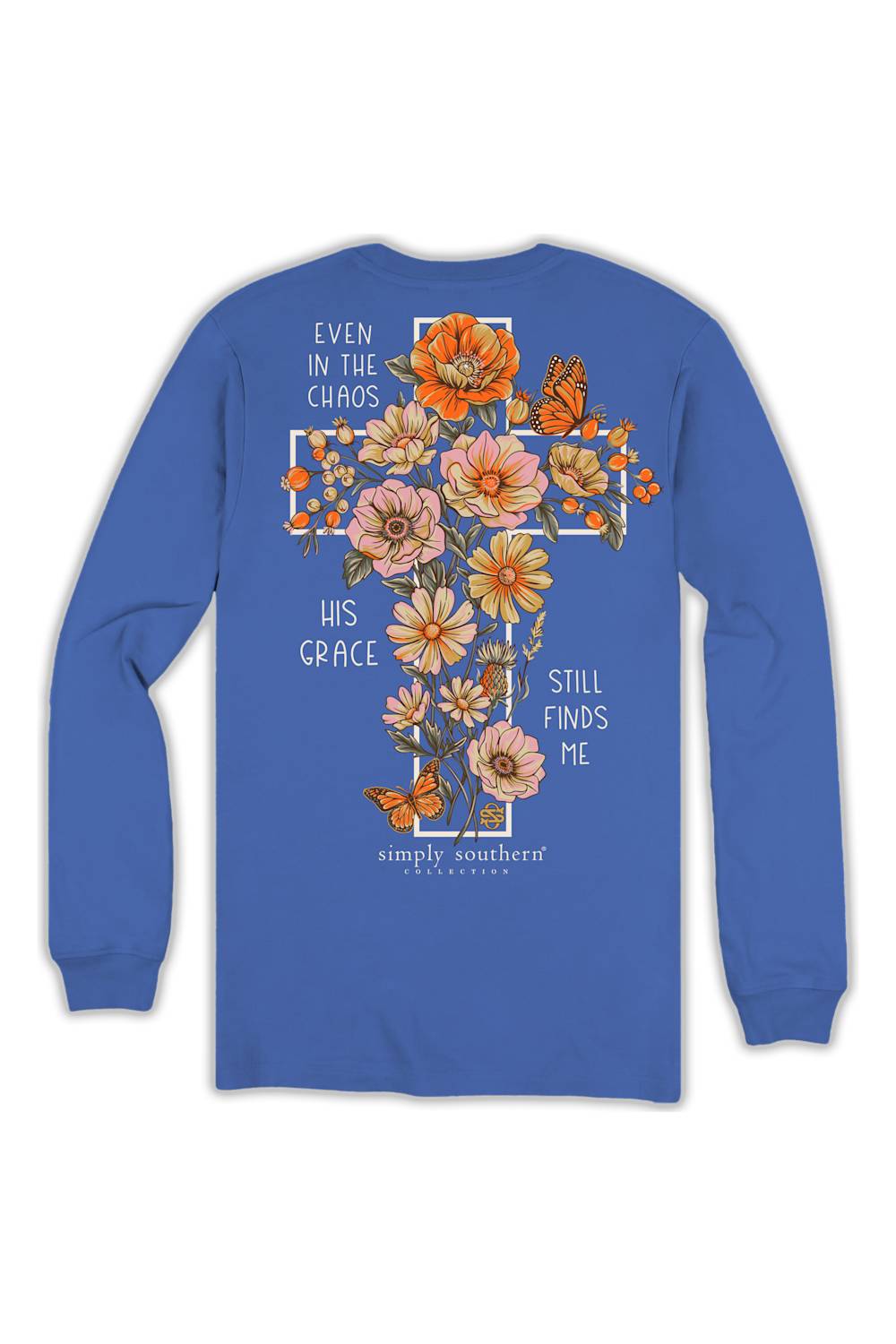 A royal blue long-sleeve t-shirt shown from the back, featuring a large graphic print of a cross decorated with orange and pink flowers, butterflies, and white text that reads 'EVEN IN THE CHAOS HIS GRACE STILL FINDS ME' with 'simply southern' printed below.