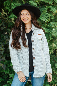 Soft fleece button up shacket with cuffs, and tortoiseshell buttons and chest pockets 