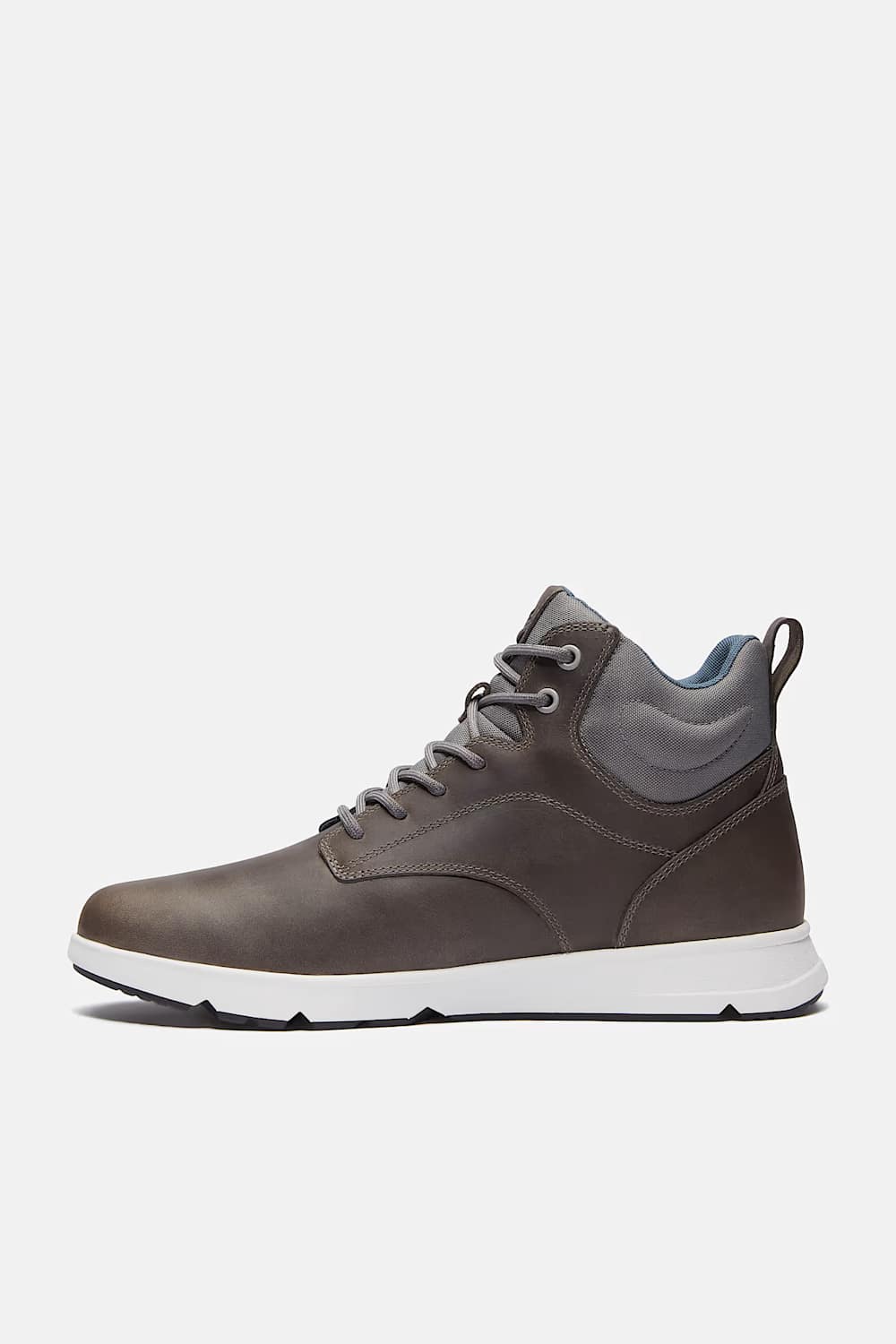 A pair of mid-top lace-up sneakers in a dark brownish-gray leather, featuring gray laces, a white midsole, and a light blue interior lining, shown against a light gray background.