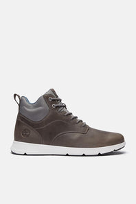 A pair of mid-top lace-up sneakers in a dark brownish-gray leather, featuring gray laces, a white midsole, and a light blue interior lining, shown against a light gray background.