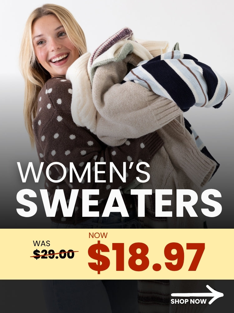 A promotional banner promoting women's sweaters that were originally $29, but are now $18.97. In the image there is also a woman wearing a brown/white polka sweater holding multiple different styles of sweaters and a white arrow in the bottom right corner with a SHOP NOW call-to-action