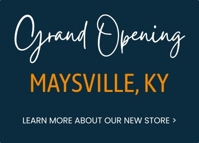 Dark blue promotional banner with the text "Grand Opening Maysville, KY" in white and orange lettering, along with the call-to-action, "Learn More About Our New Store."