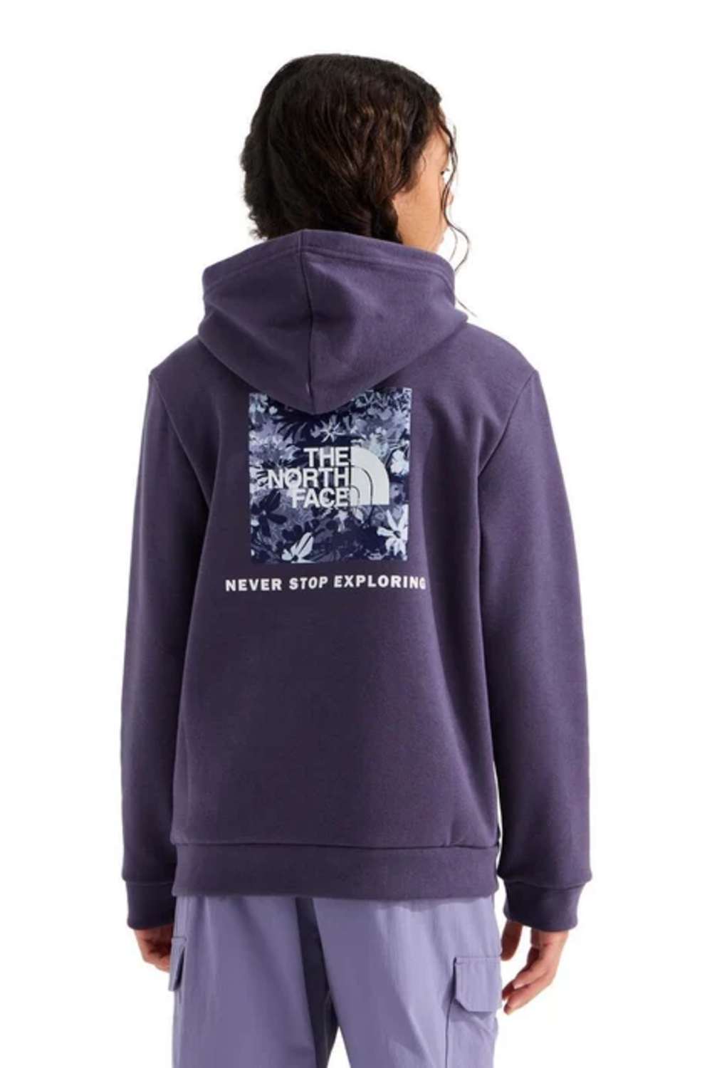 A person shown from the back wearing a purple hoodie with a large The North Face graphic on the back, paired with light purple cargo pants, against a plain white background.