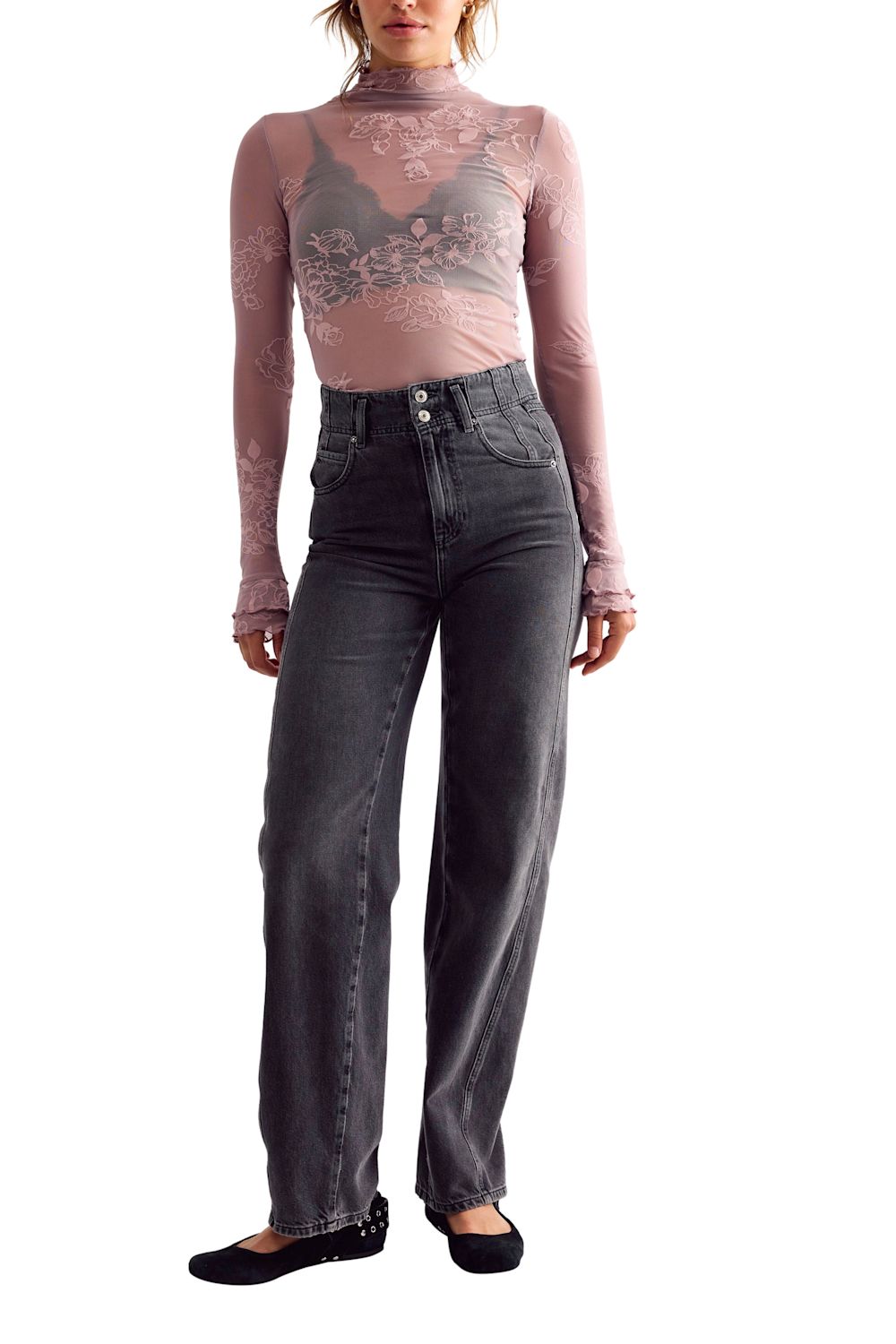 sheer floral lace lingerie in a muted mauve-pink tone, layered over a black bra.