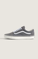 A pair of gray suede Vans Old Skool sneakers with white laces and white side stripes, displayed on a light beige background.