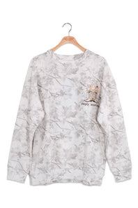 A long-sleeve crewneck sweatshirt with a light gray and white floral pattern, hanging on a wooden hanger. It features a small chest graphic with a pair of boots and the text 'simply southern'.