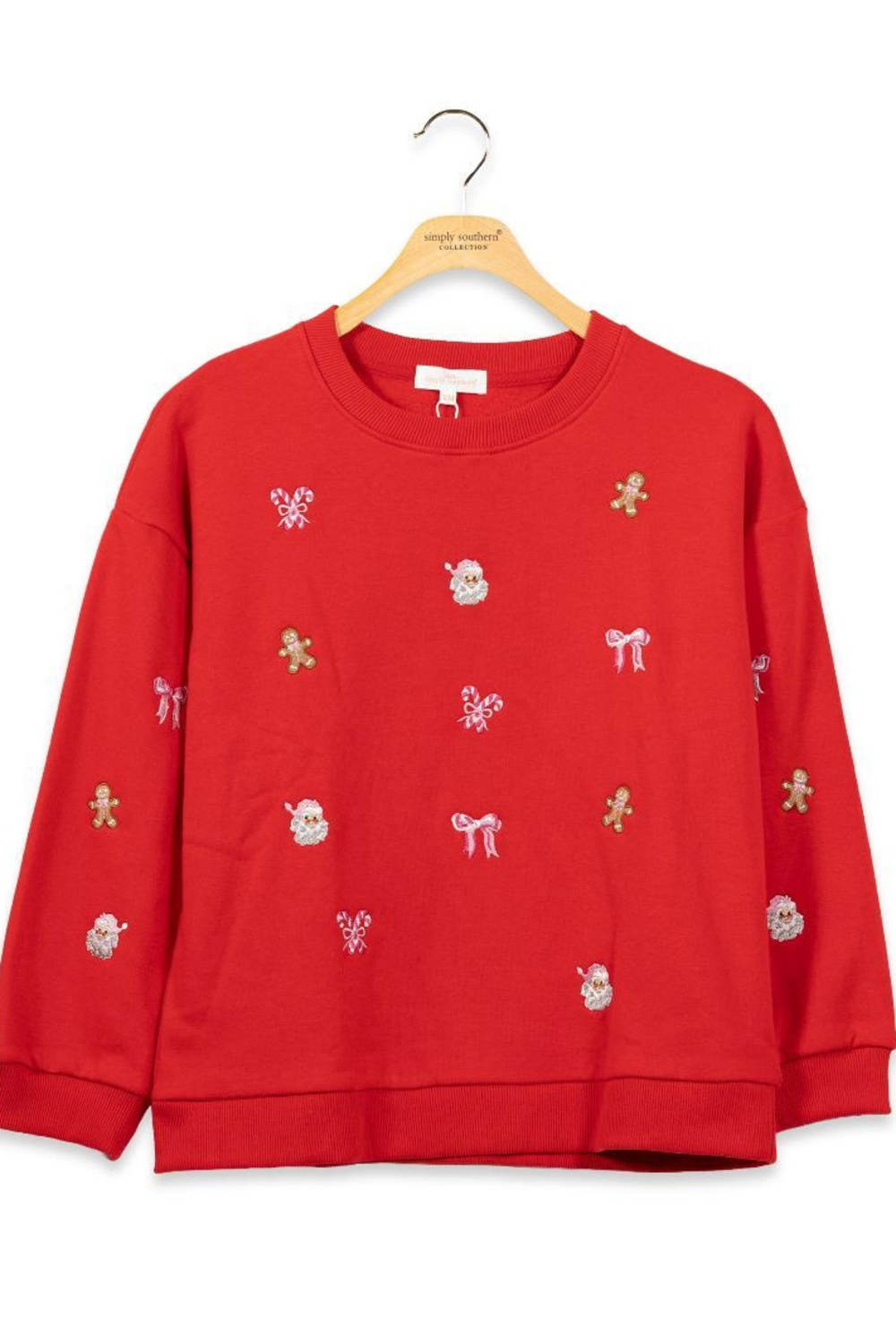 Youth girls embroidered red crewneck with holiday themed embroidery all over