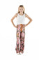 A young girl stands against a white background wearing a white tank top and pink camouflage print pajama pants with an orange drawstring.