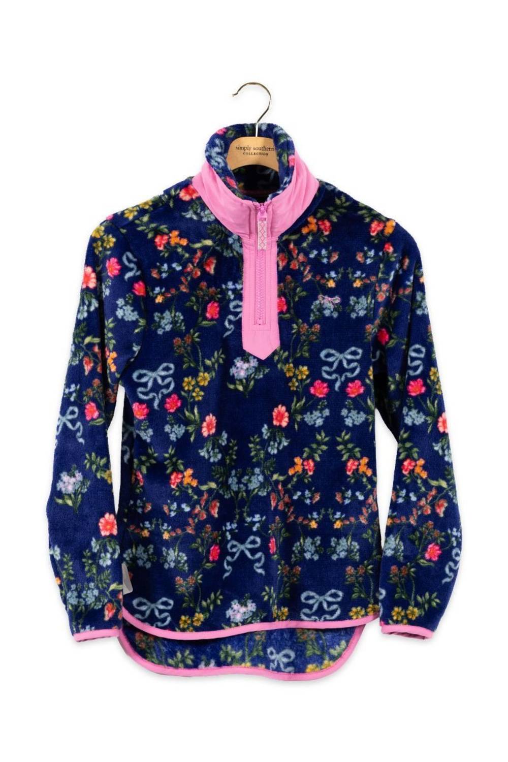 Fleece zipneck pullover with pink accents, with a flower and bow pattern all over