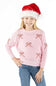 A young girl wearing a pink ribbed knit sweater with red candy cane motifs, blue jeans, and a red Santa hat, posing against a solid white background.