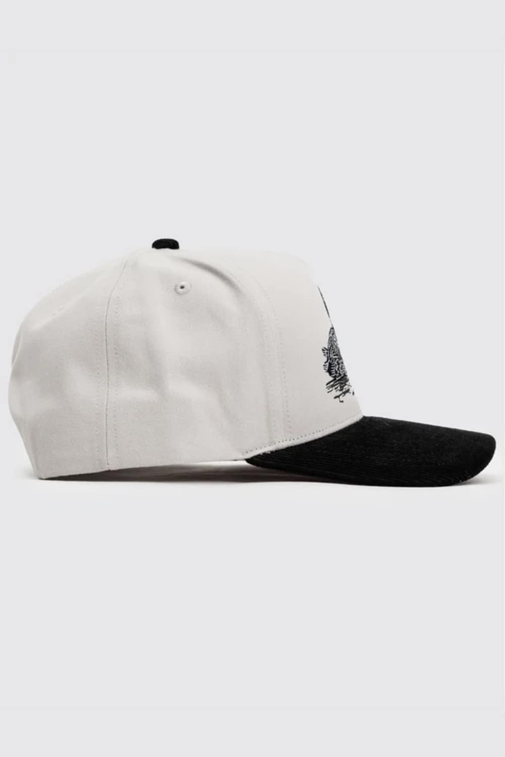 A baseball cap with a white crown and a black brim, featuring a small black graphic on the side.