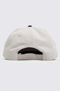 The back of a light gray snapback cap, showing the fabric panels, ventilation eyelets, and adjustable strap 