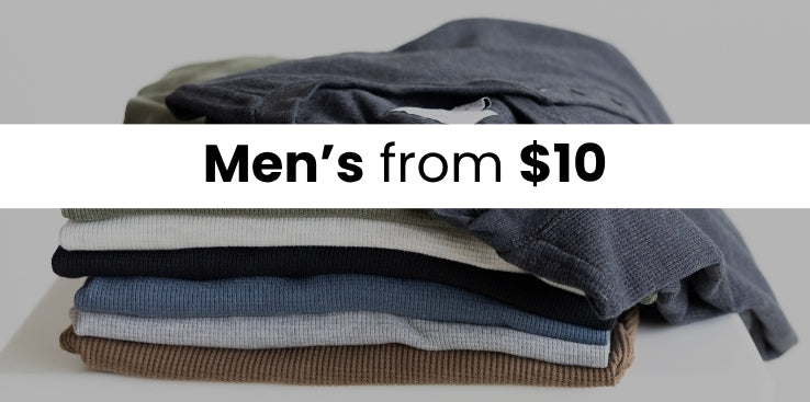 A stack of basic t-shirts. The image has a dark overlay and a white stripe with text that reads Men's from $10
