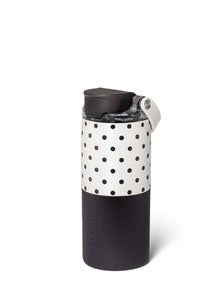 A reusable insulated tumbler with a black lower half, a white upper half covered in black polka dots, and a black lid with a white carry loop, shown on a white background.