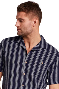 Weatherproof Vintage Linen Camp Shirt for Men in Navy Stripe; Man wearing a navy and gray striped shirt on a white background