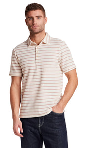 Weatherproof Vintage Terry Striped Polo for Men in Crimson; Man wearing a striped polo shirt and jeans on a white background