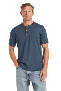 Weatherproof Vintage Jersey Henley Shirt for Men in Cobalt; Man wearing a blue henley shirt and jeans on a white background